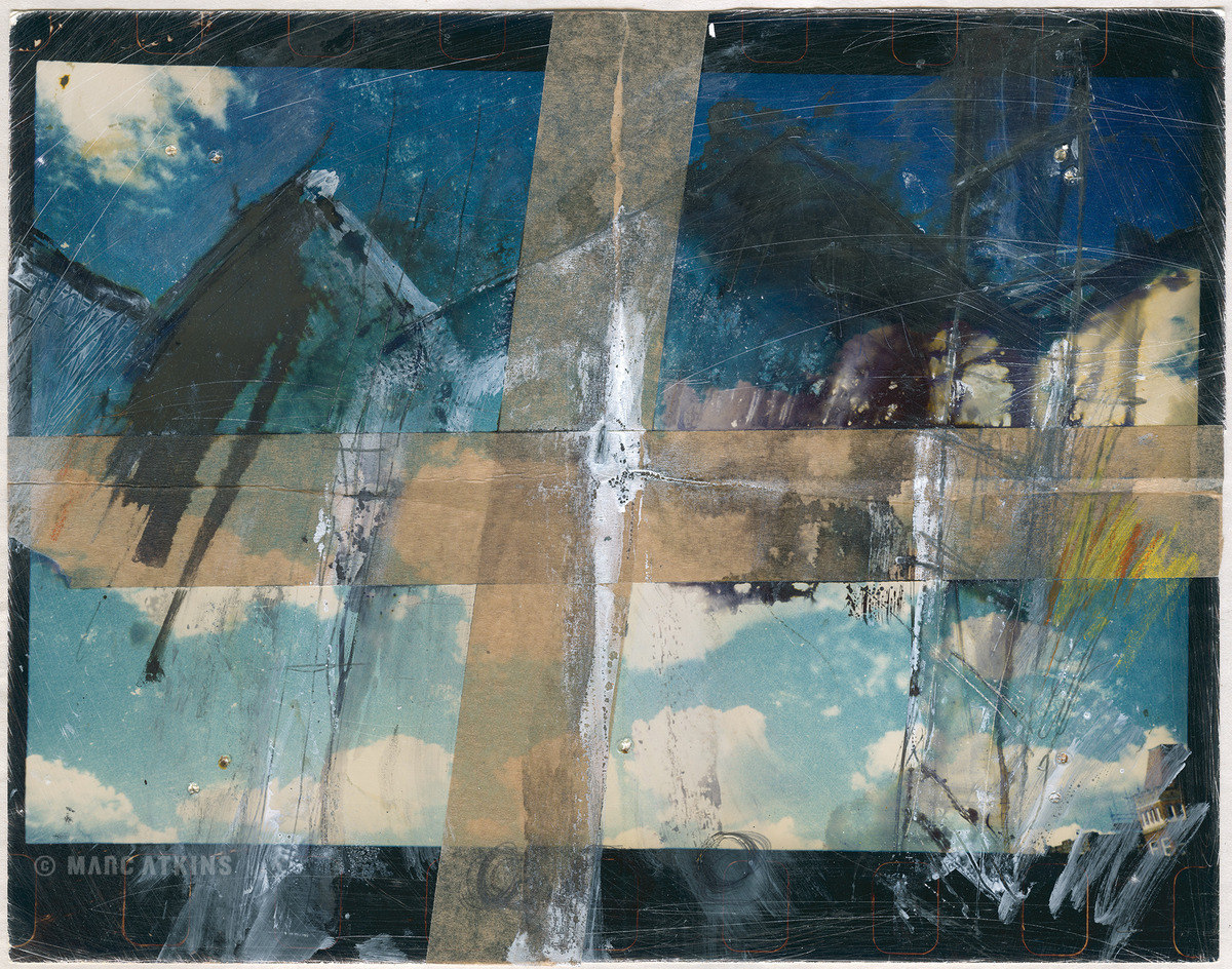Abstract layers of blue, grey and cream with dark linear marks